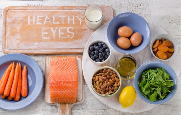 Assorted foods on a table that will help treat dry eye naturally and improve overall eye health