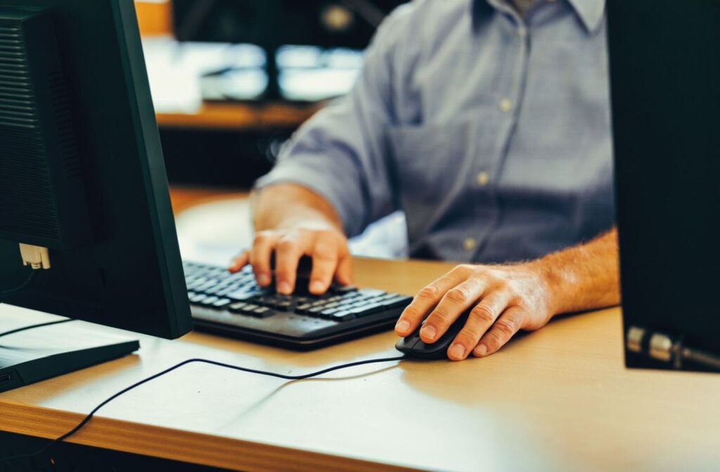 Person working at a desktop computer during prolonged screen use.